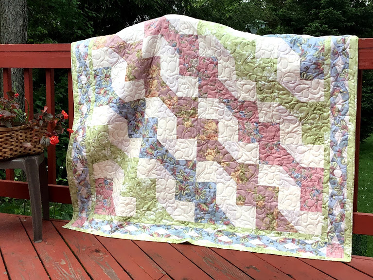 "Shades of Spring" is a Free Mystery Quilt Pattern designed by Lori Dickman from Quilting with Lori!